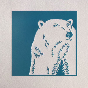 Letterpress print of polar bear stepping out of the night.